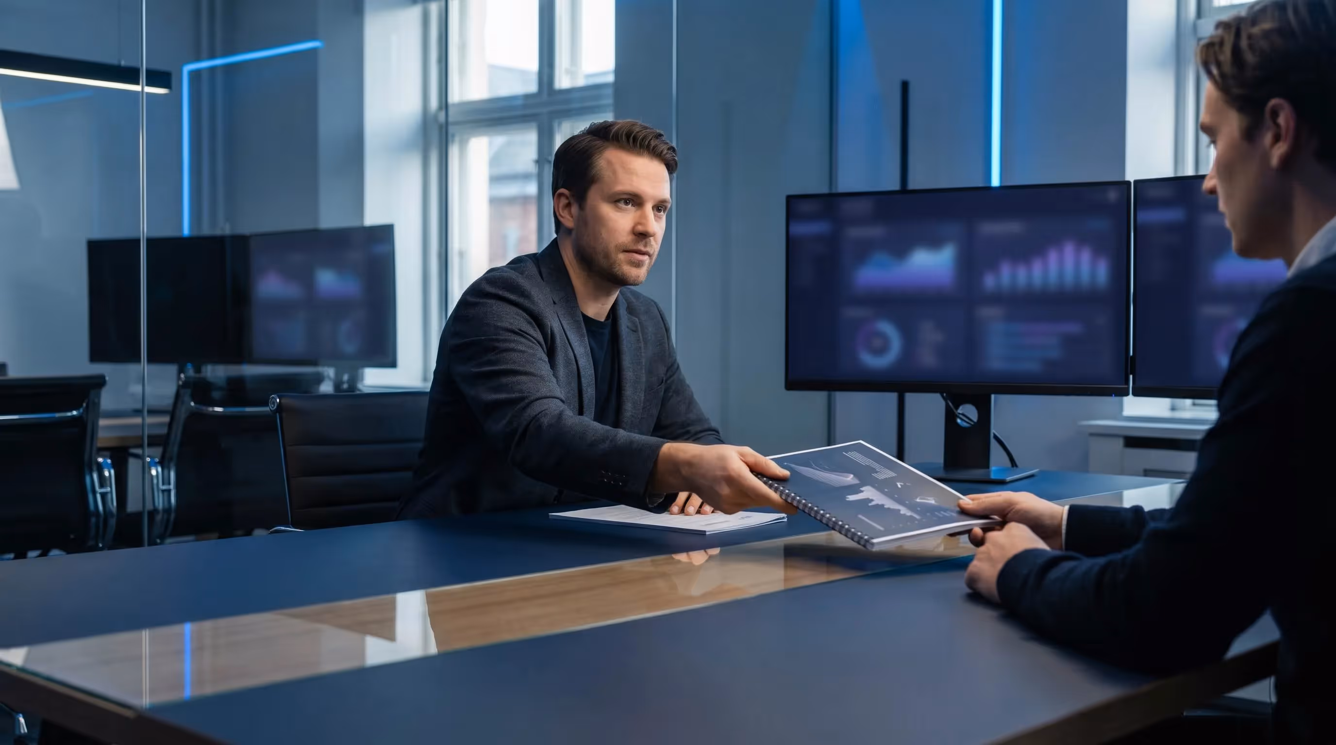 SEO consultant sliding a beautifully designed monthly performance report to a client at a meeting table
