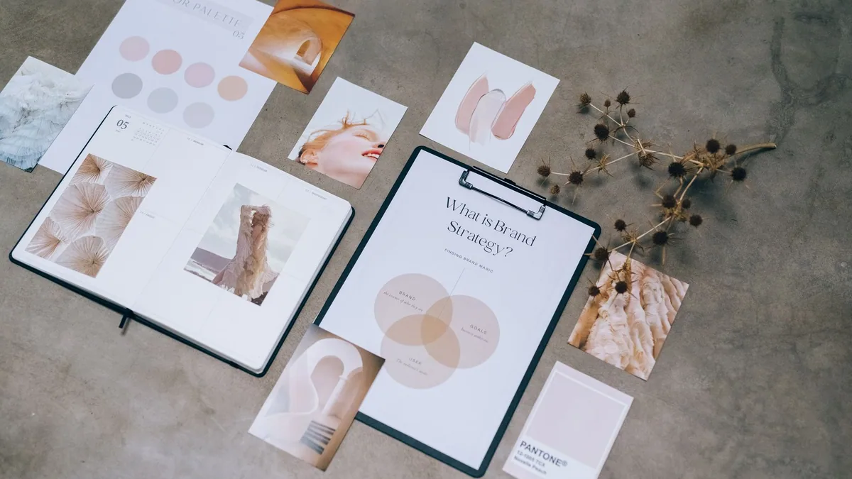 Branding materials and colour swatches laid out on a desk, illustrating the ranking of the best branding agencies in France