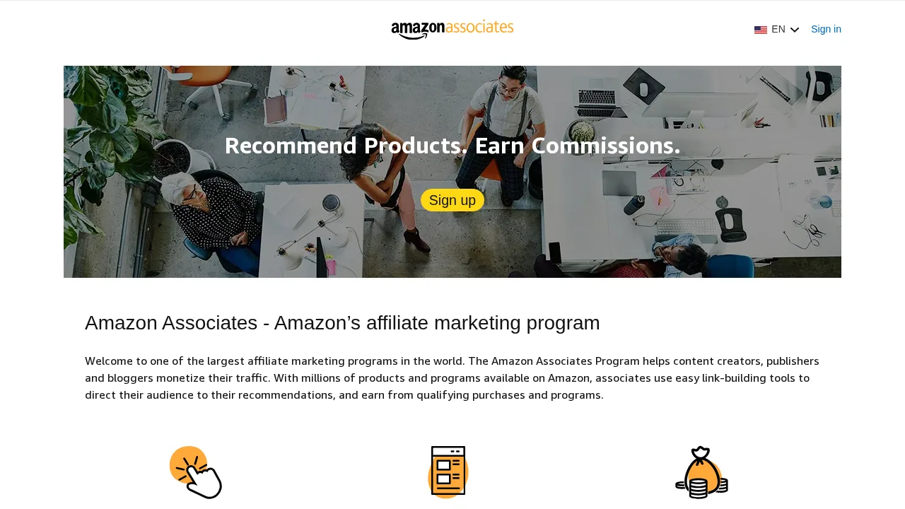 Amazon Associates ana sayfası: bir ofis fotoğrafı üzerinde “Recommend Products. Earn Commissions.” bandı, Sign up düğmesi ve programın tanıtımı