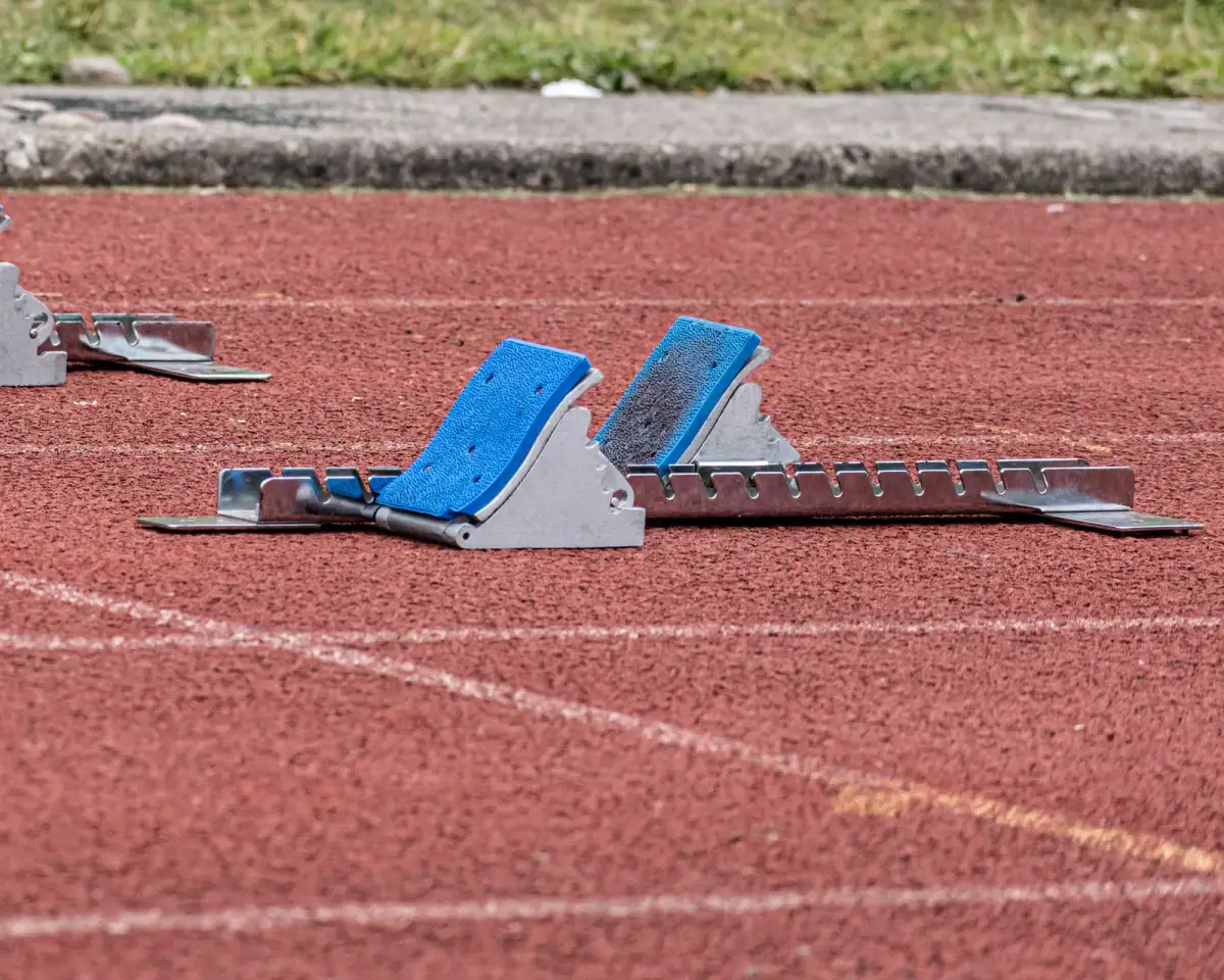 Starting blocks set on a red running track