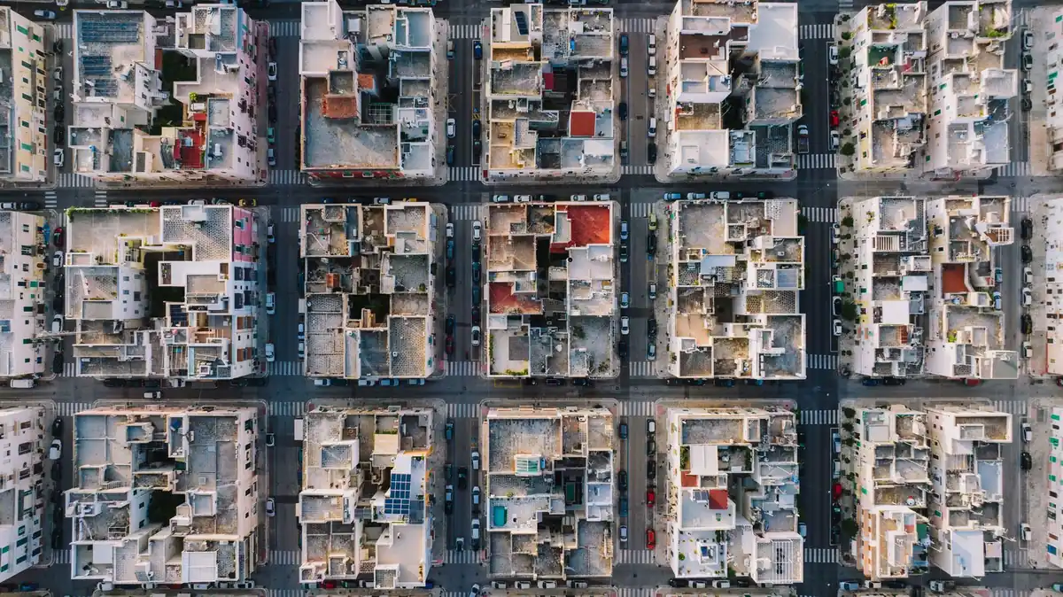 Aerial view of a city laid out in a regular grid of blocks