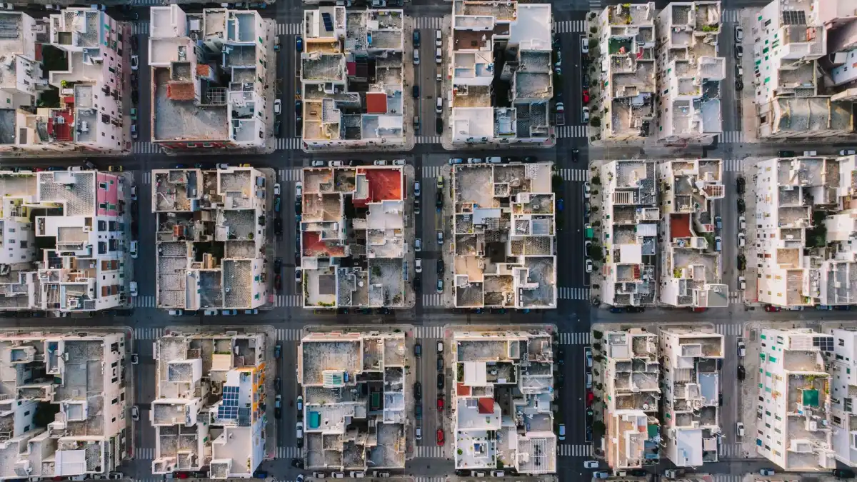Aerial view of a town laid out in a regular grid of streets and rooftops