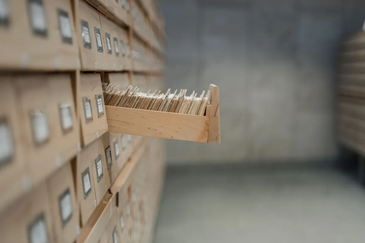 An open drawer of index cards in a library archive